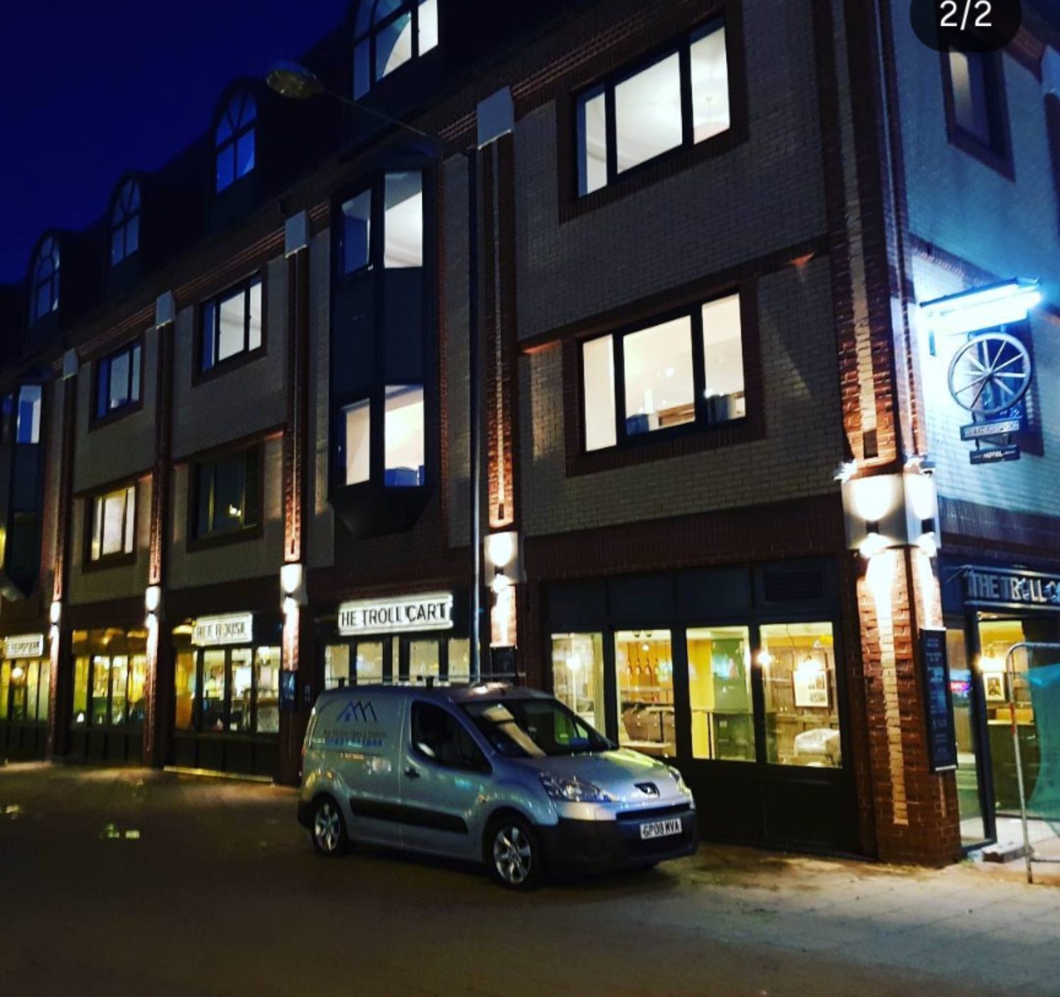 Evening commercial window cleaning for town-centre hospitality premises