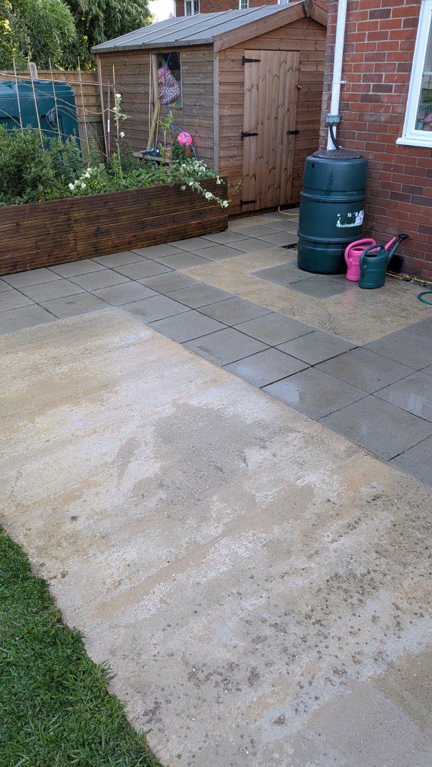 Patio after pressure washing from a rear angle